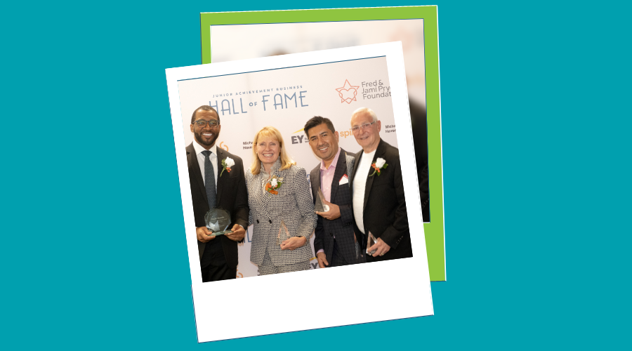 2022 Business Hall of Fame laureates Darcy Howe, Fred Pryor, Carlos Antequera, and Chris Goode pose with awards at event