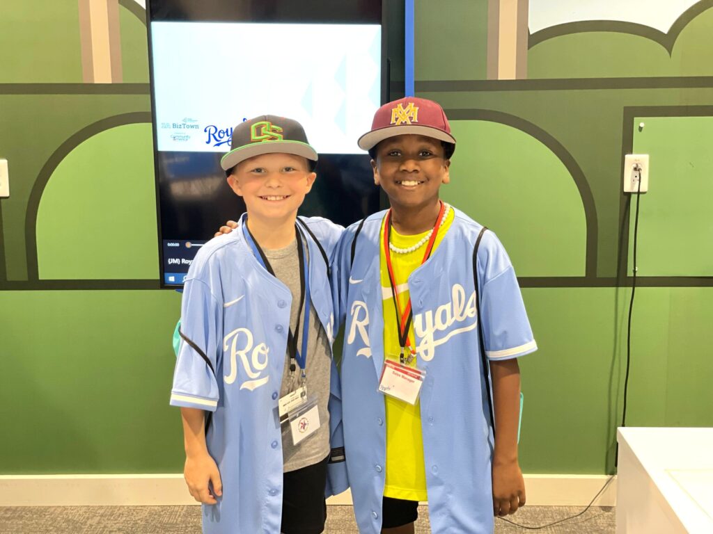 Two students in Royals gear in JA BizTown