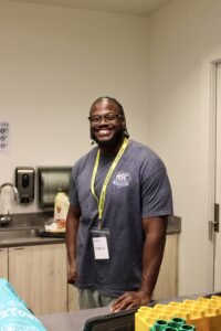 A man standing and smiling