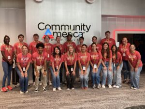 Group of employee volunteers standing together for a photo